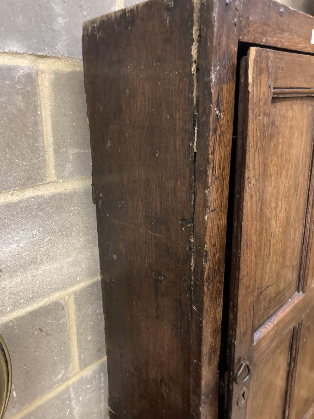 An 18th century panelled oak cupboard, width 74cm depth 30cm height 166cm